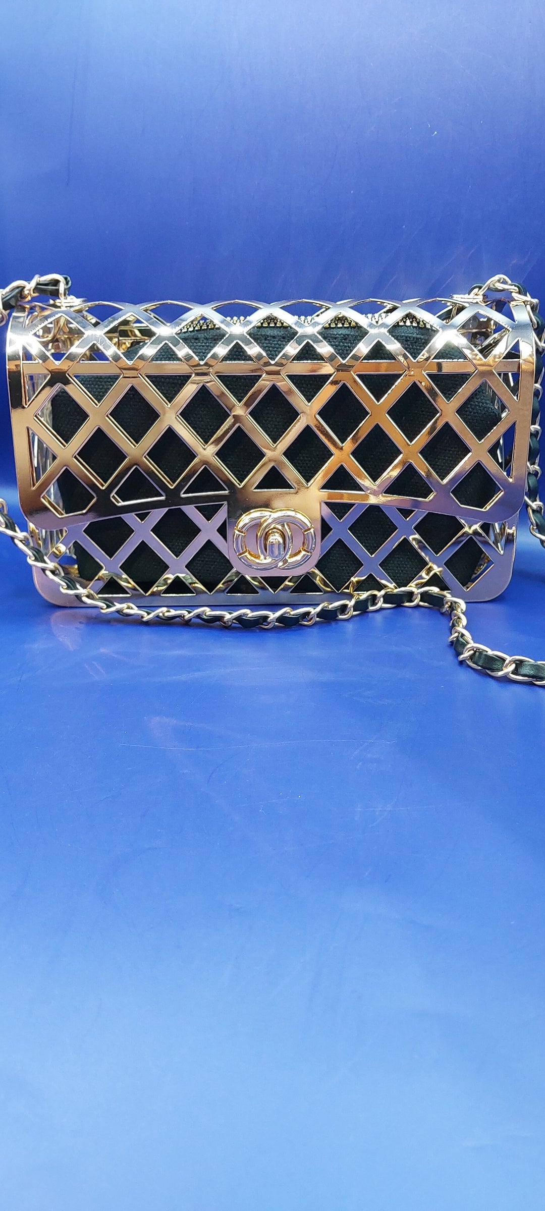 Black and Gold Cage Handbag with a Gold Braided Chain Strap