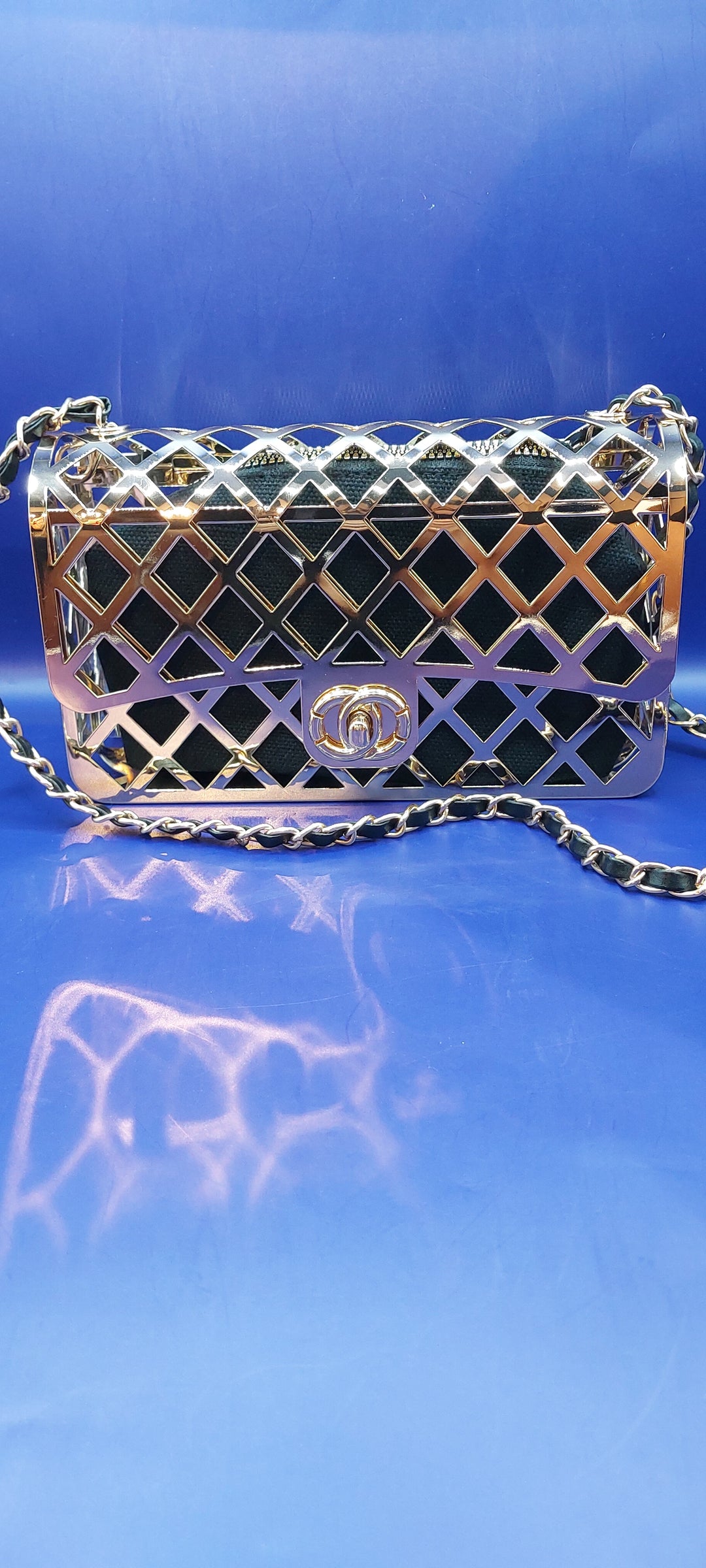 Black and Gold Cage Handbag with a Gold Braided Chain Strap